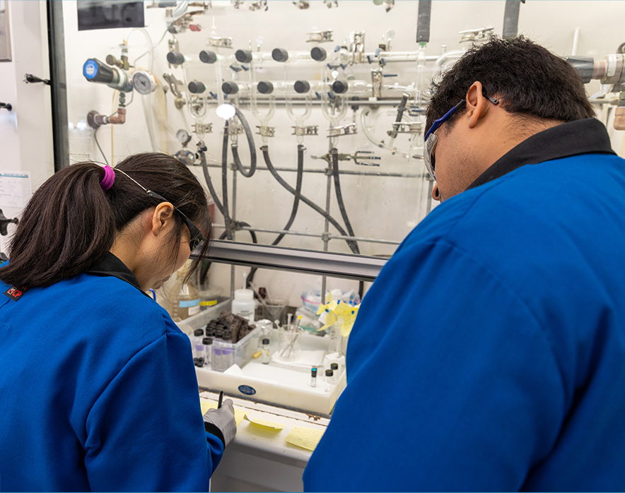 Two researchers collaborate in a lab environment